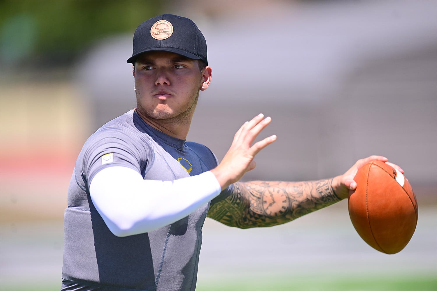 Dillon Gabriel throwing a pass while wearing EvoShield rib shirt